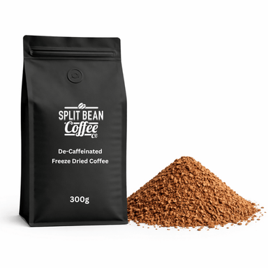 Black decaf coffee packaging with 'Split Bean Coffee' branding and decaf freeze-dried coffee powder on a white background