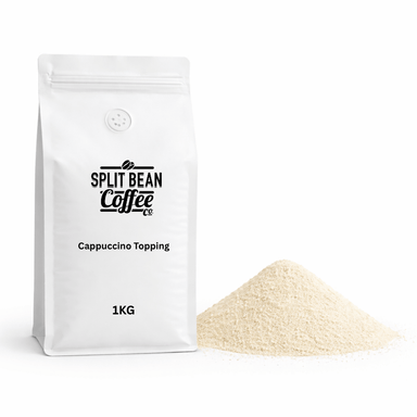 White bag of Split Bean Coffee Co. 1kg cappuccino topping with a small pile of cappuccino topping powder on a white background