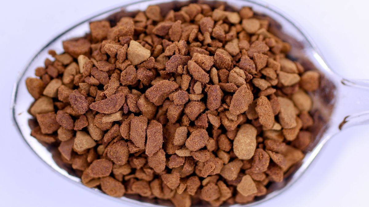 Close up of freeze dried coffee granules on a spoon