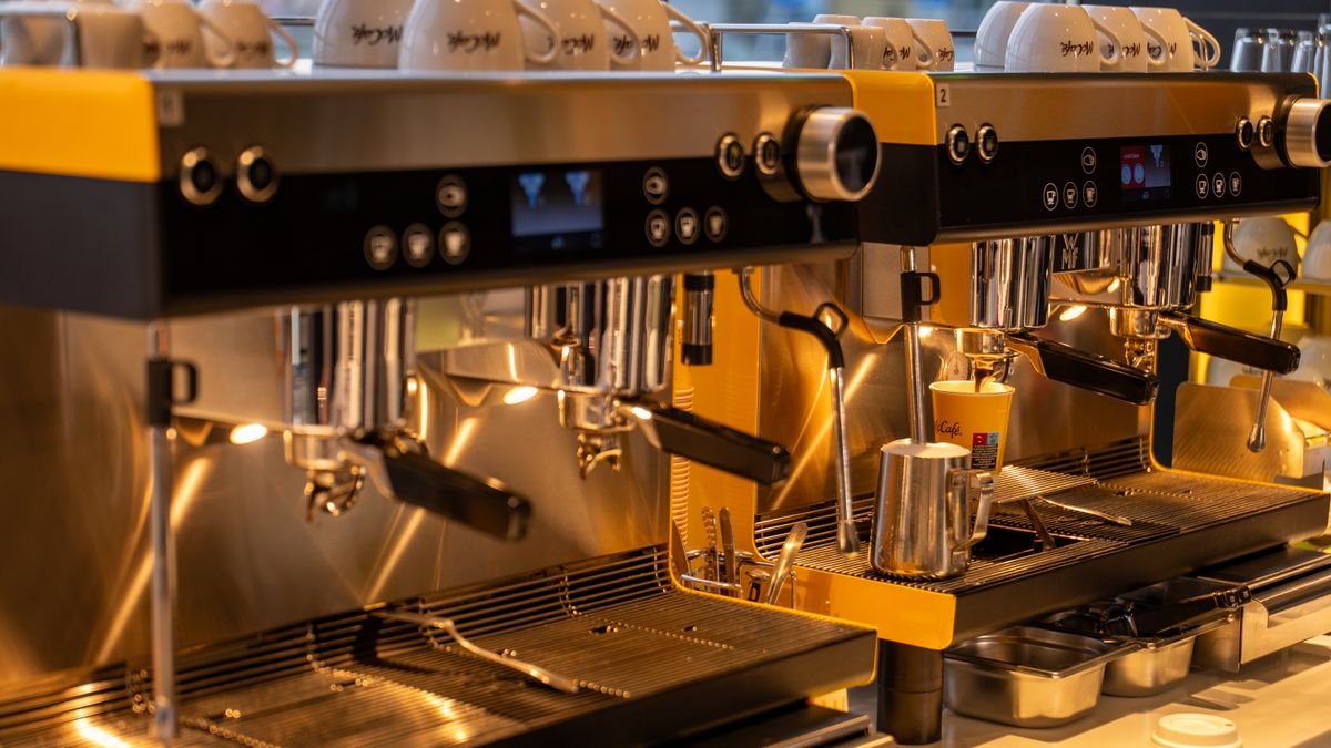 Commercial espresso machines on a cafe counter
