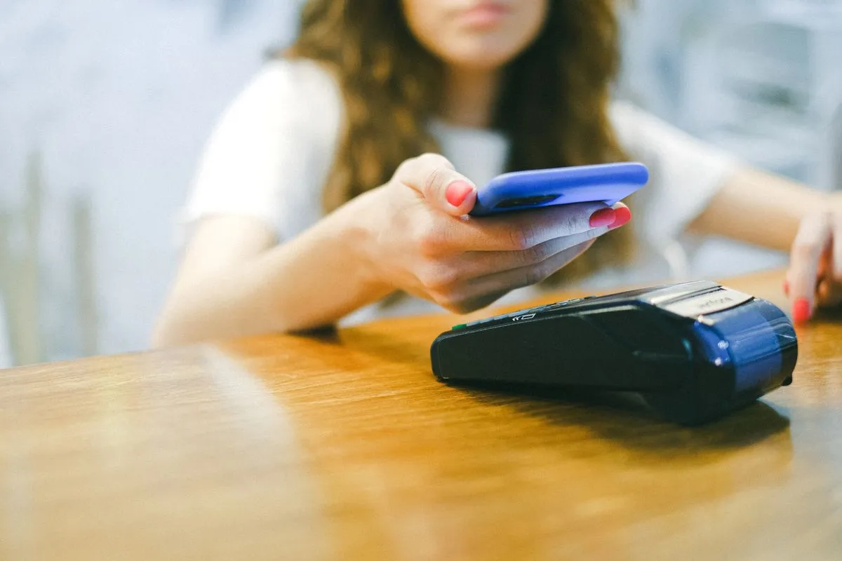 Contactless card payment being made at a coffee machine