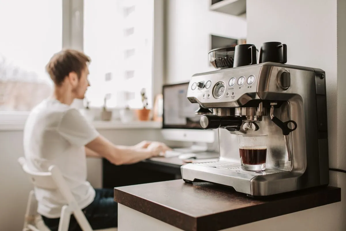 Office coffee machine on a counter serving a hot drink