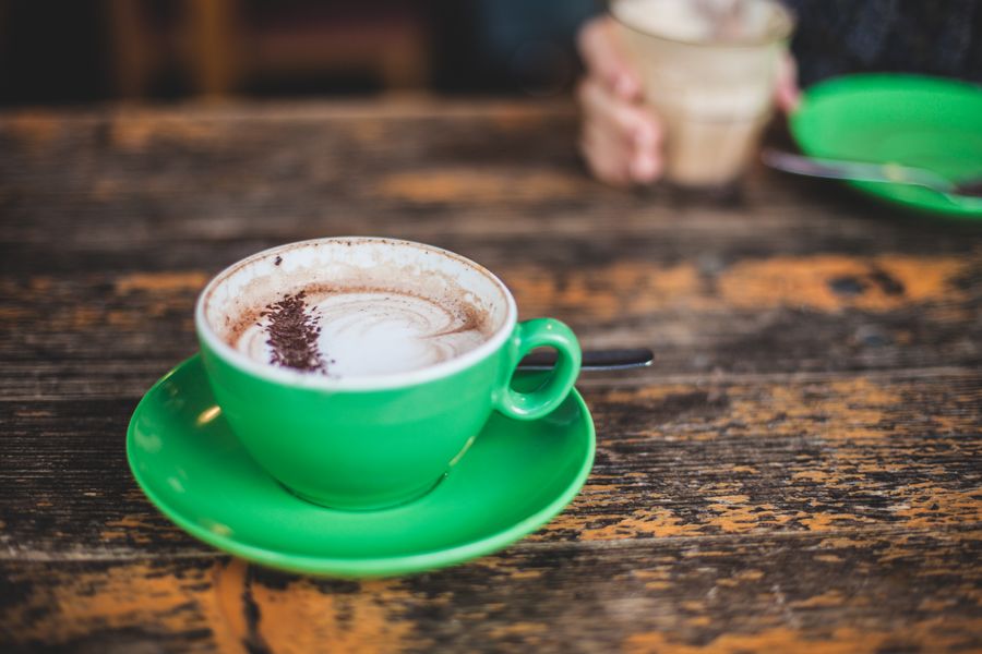 Cappuccino with foam art in a ceramic cup, the kind of quality a well-chosen commercial office coffee machine produces